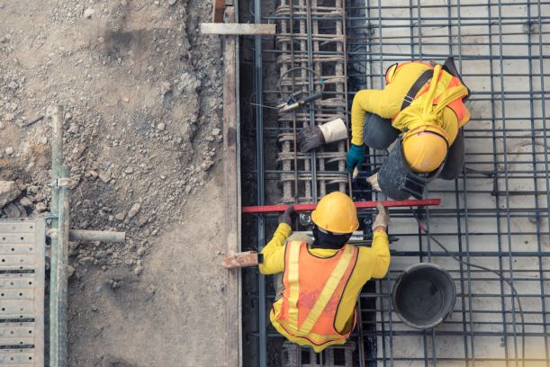 Men Doing Dangerous Construction